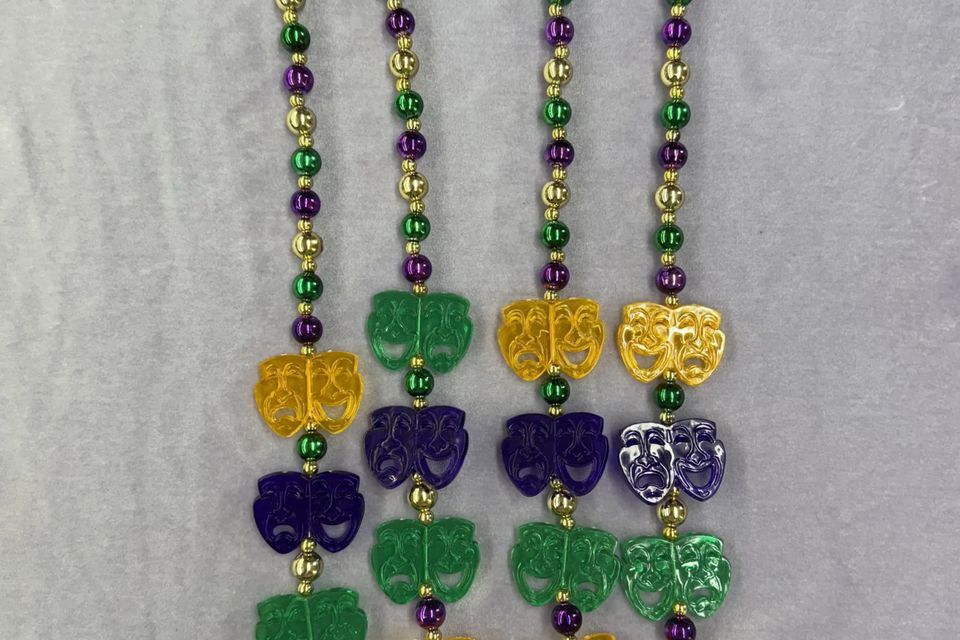 Comedy and tragedy beads in Mardi Gras colors - purple green and gold. 