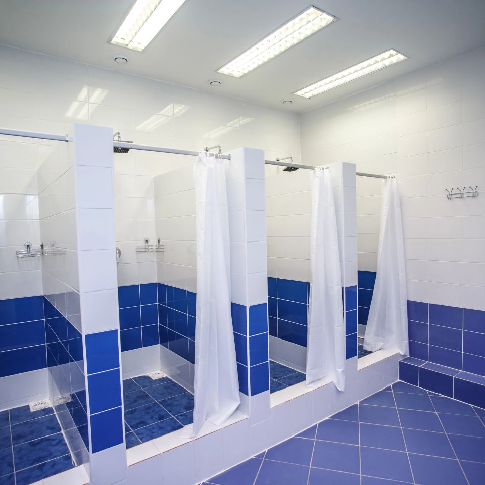 4 blue and white shower cabins