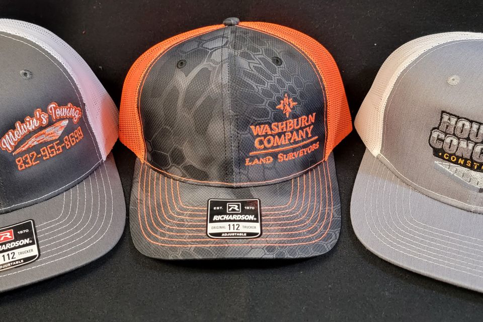 Baseball caps with embroidered company logos 