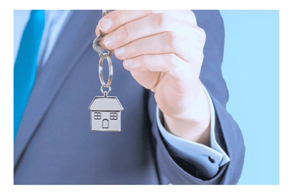 Realtor holding key to property