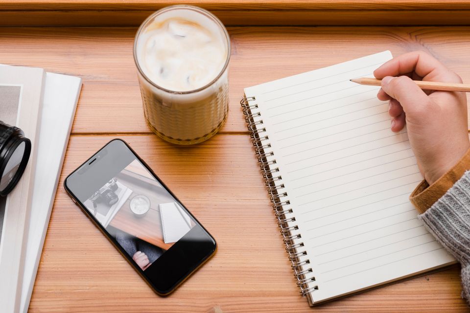 Woman with smartphone cup coffee