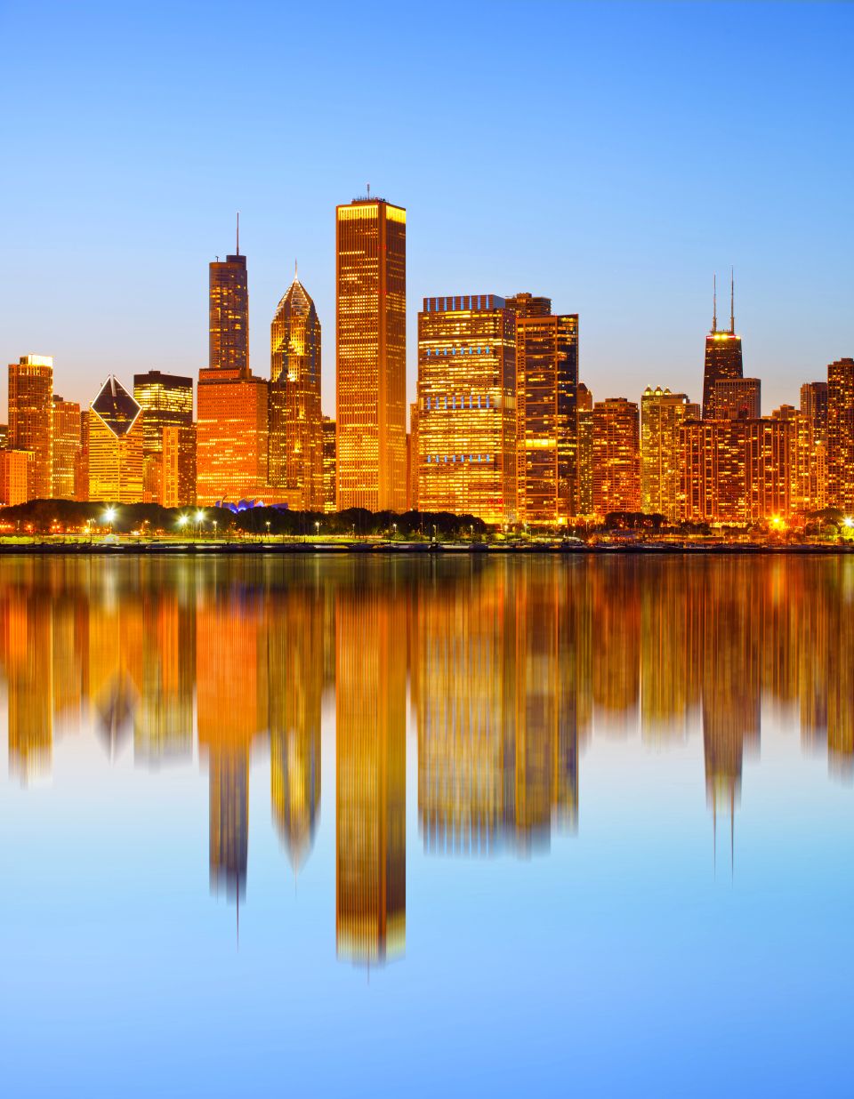 City of Chicago USA, colorful sunset panorama skyline of downtown with illuminated business buildings with reflections