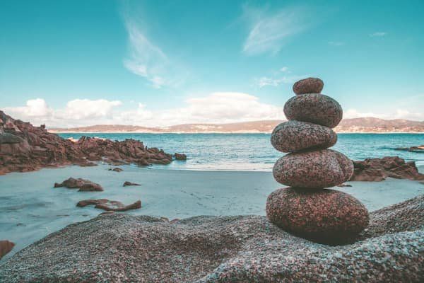 Rocks stacked like a cairn at the beach 