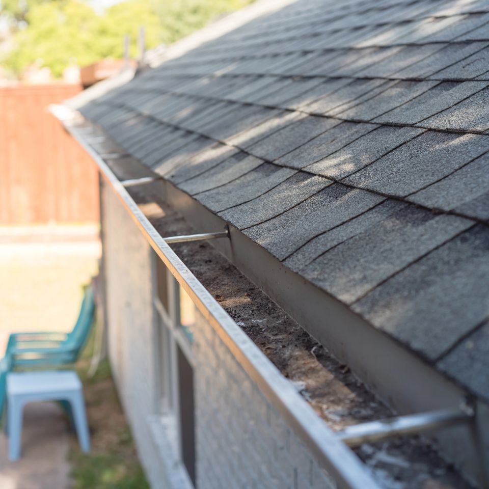 Clean gutter after clearing of dried leaves and dirty