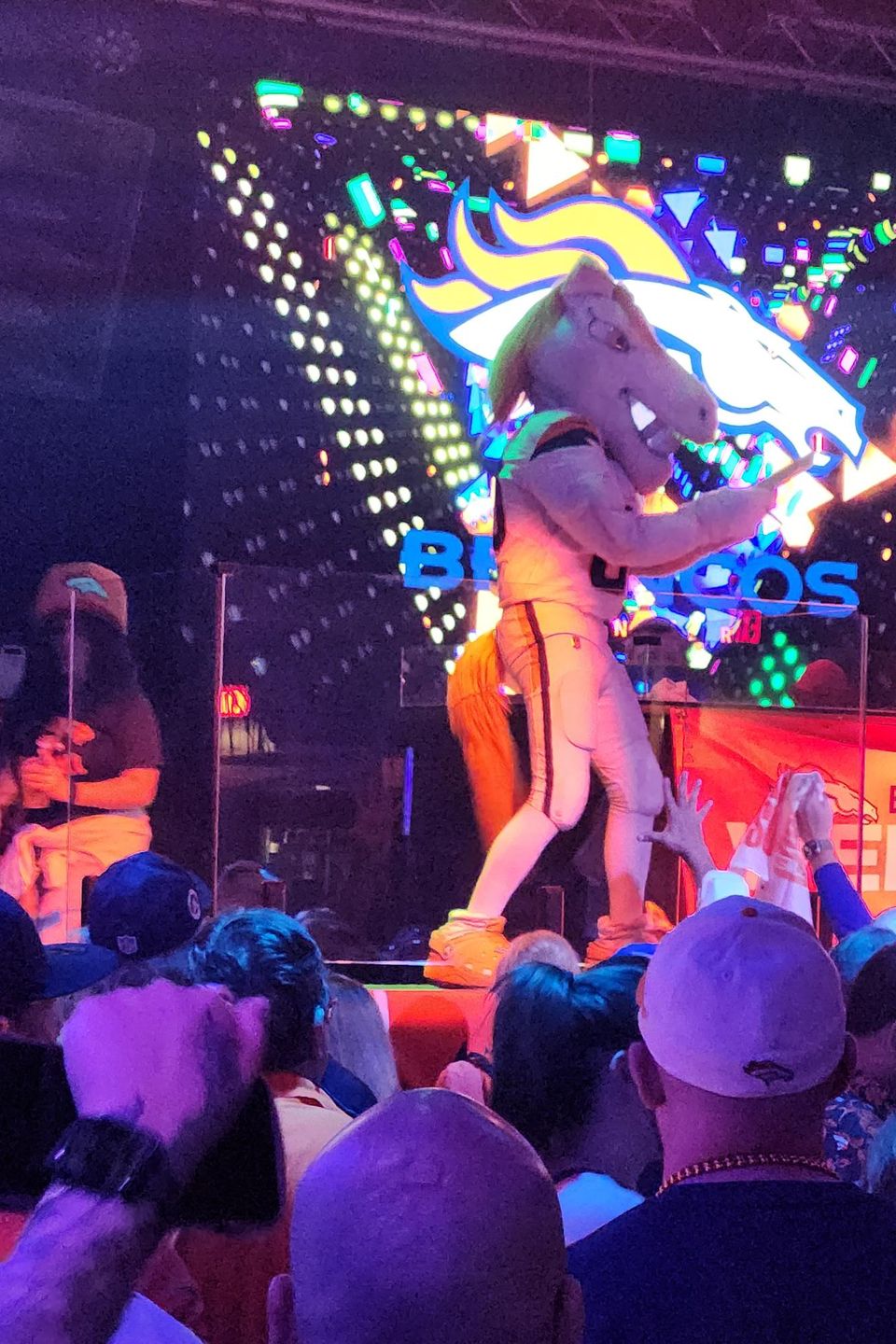 Denver Broncos mascot performing on stage during a Carpe Diem Events pre-game fan party in New Orleans