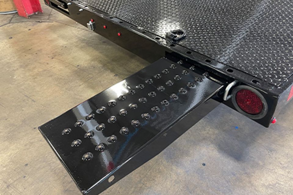 Trailer features rear 5ft slide out ramps