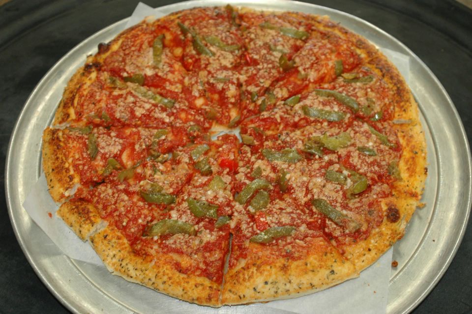 Brier Hill Pizza topped with peppers, tomato sauce, and grated cheese at Cocca’s Pizza.