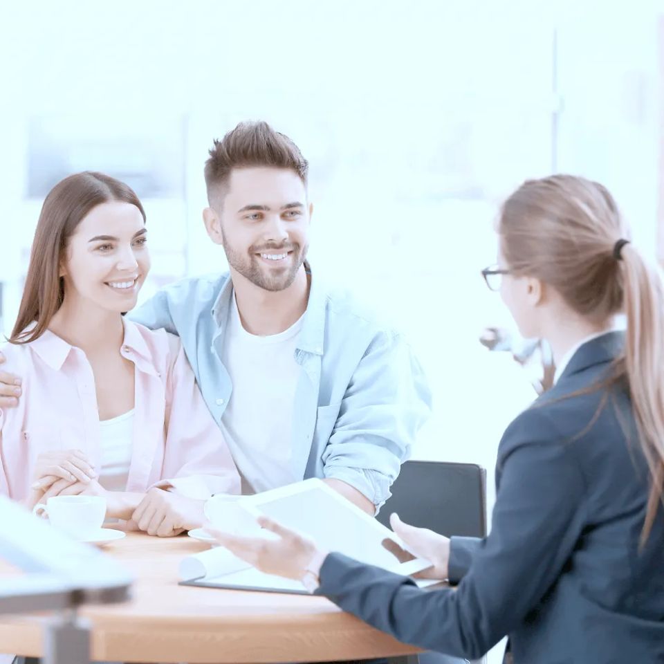 Couple talking to agent