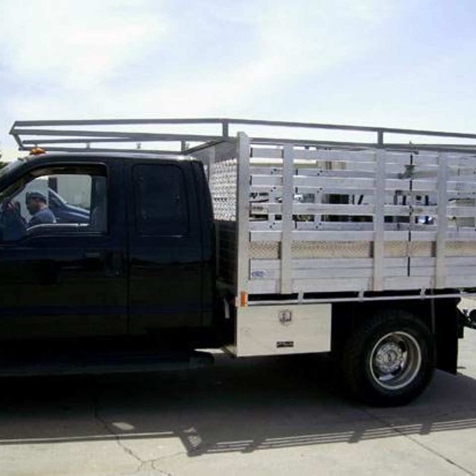Al stakebed dump w rack