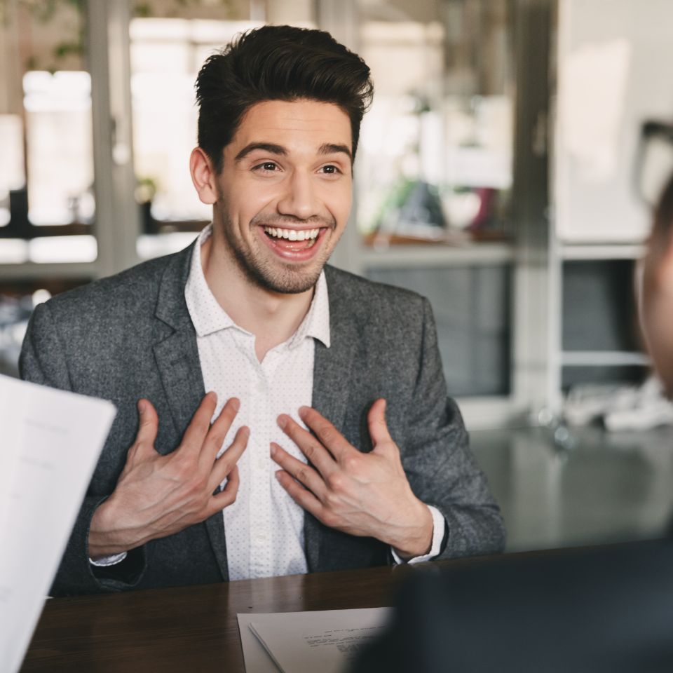 Business  career and placement concept   surprised caucasian man 30s rejoicing and showing at himself when hiring  during job interview with the prime staffing