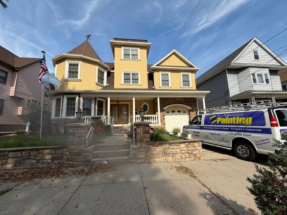 After photo of exterior painting job of a multi-level beautiful home