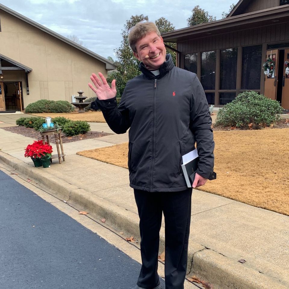 Pastor chris waving