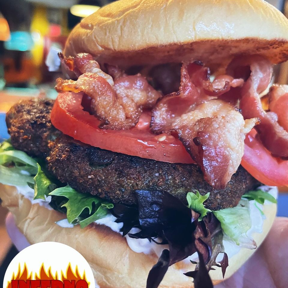 Stacked burger with tomatoes, lettuce and bacon from Inferno The Restaurant in Sound Beach