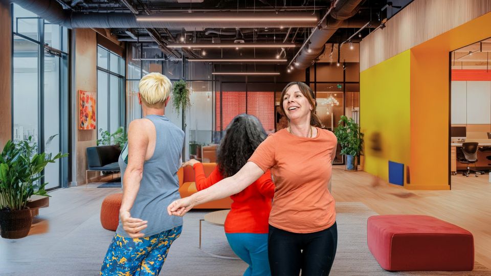 Adults using movement and play to unlock clarity during a PlayWorks session