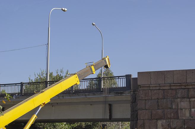 Bigstock a mobile crane performs cargo  387023572