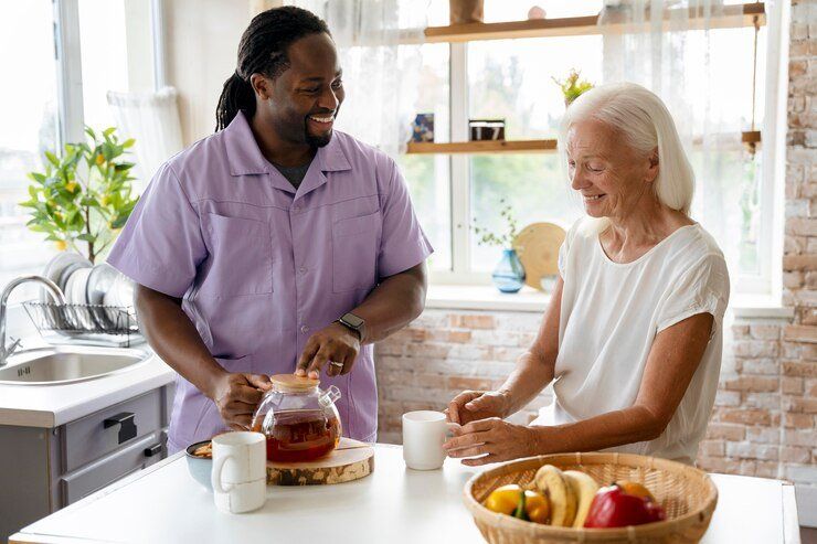 African social worker helping senior woman 23 2149031374