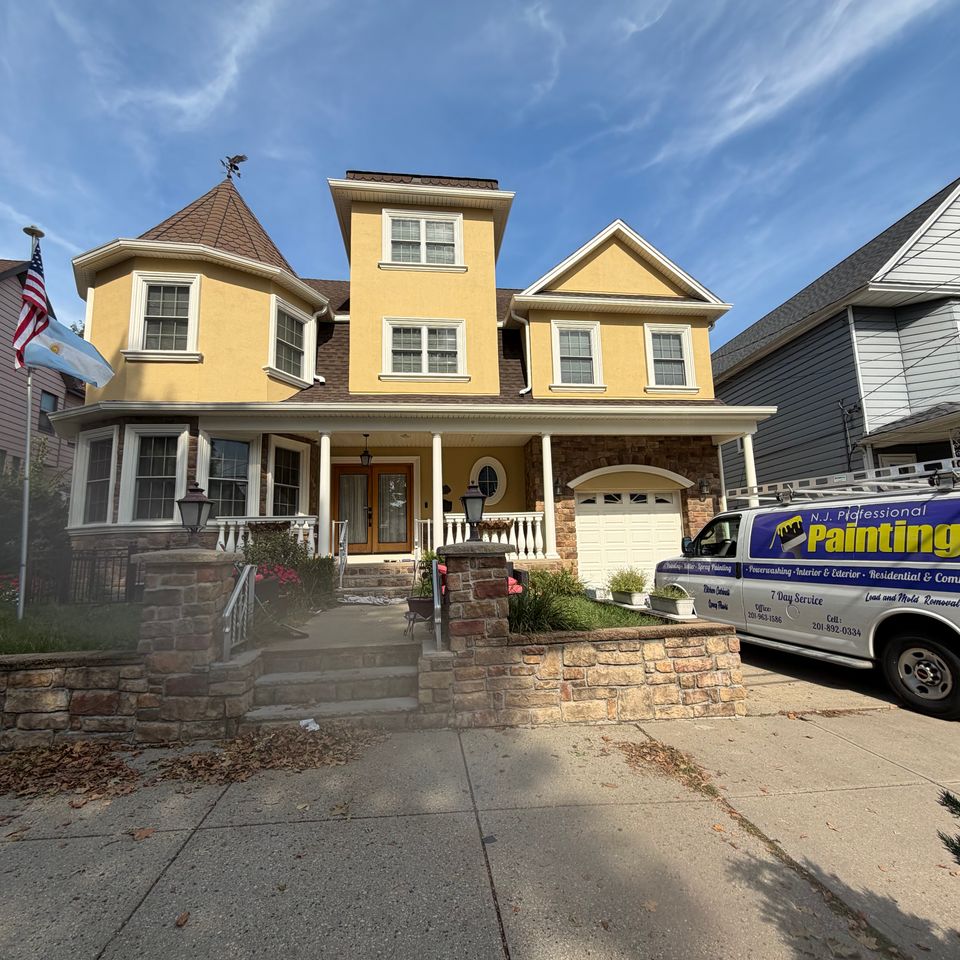 After photo of exterior painting job of a multi-level beautiful home