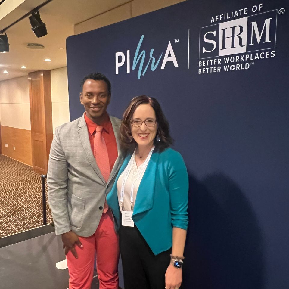 Man and woman standing smiling