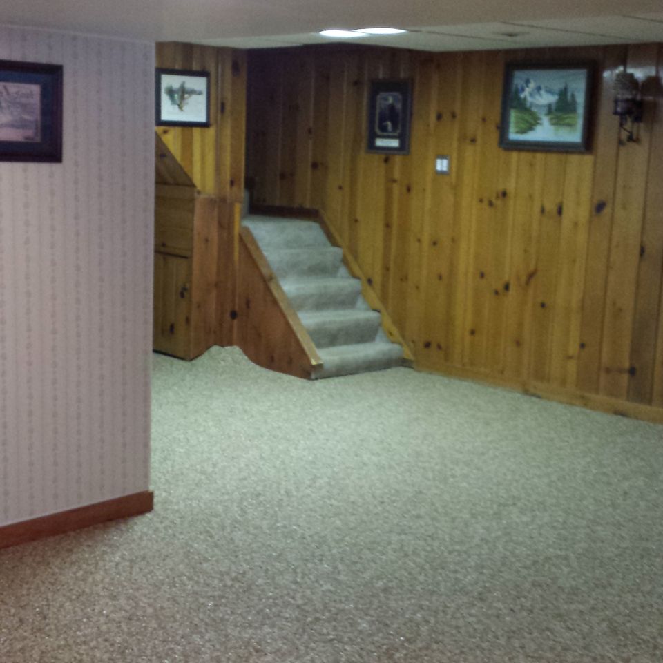 Finished basement featuring an EverStone decorative stone flooring system.