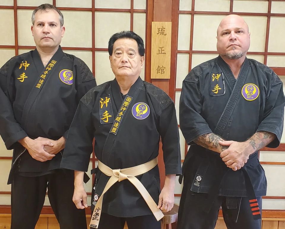 Hanshi Seiken Takamine, Kyoshi Manny Soares and Renshi Patrick Trovato posing for a photo at Takamine Karate Dojo in Miller Place