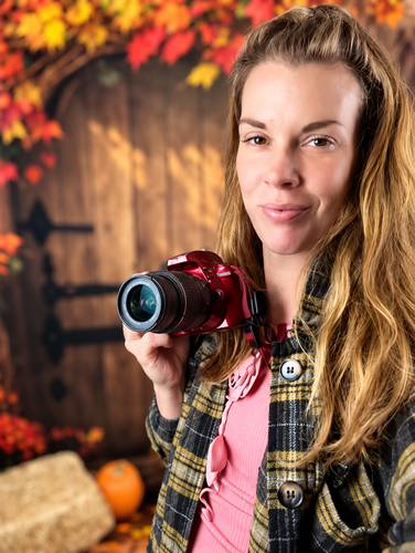 Jamie holding her camera — Through My Eyes Photography