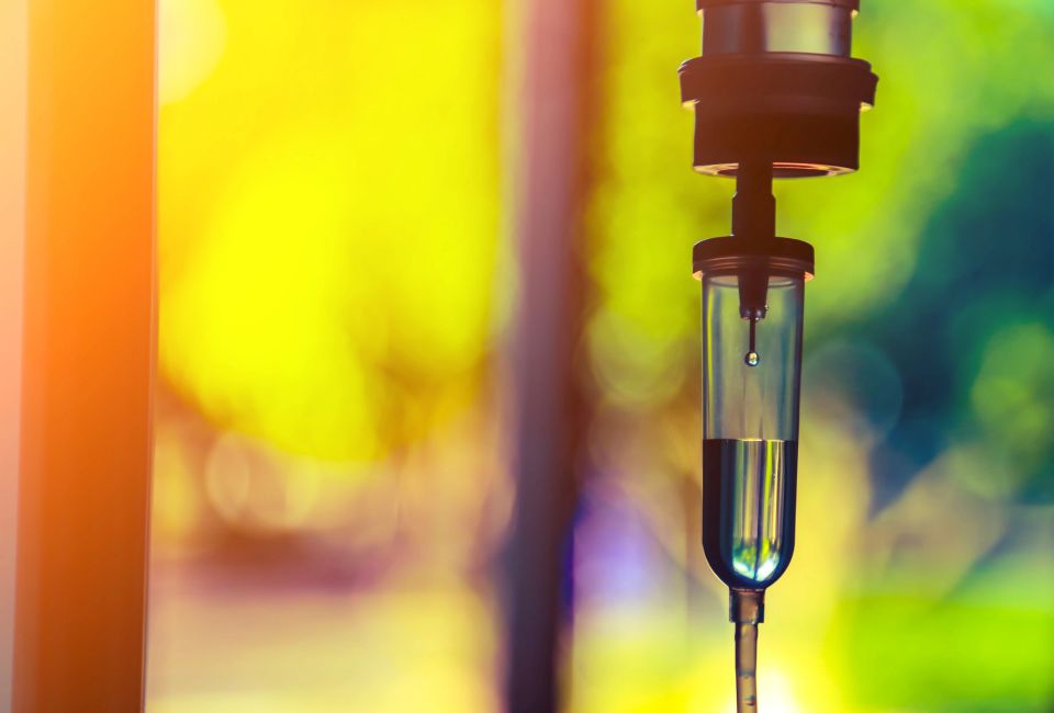 Close-up of an IV drip bag and tubing, representing the core of our mobile hydration therapy services.