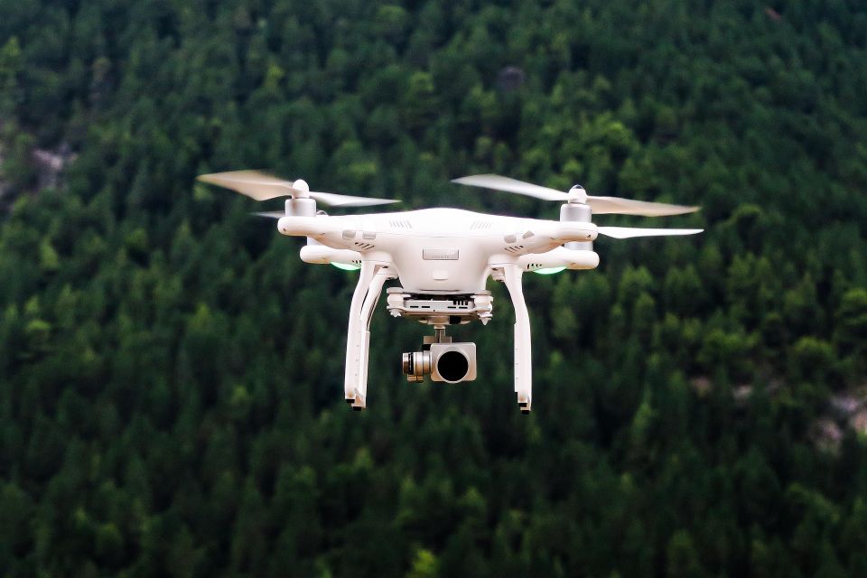 A drone being used for photography from an overview angle in the sky