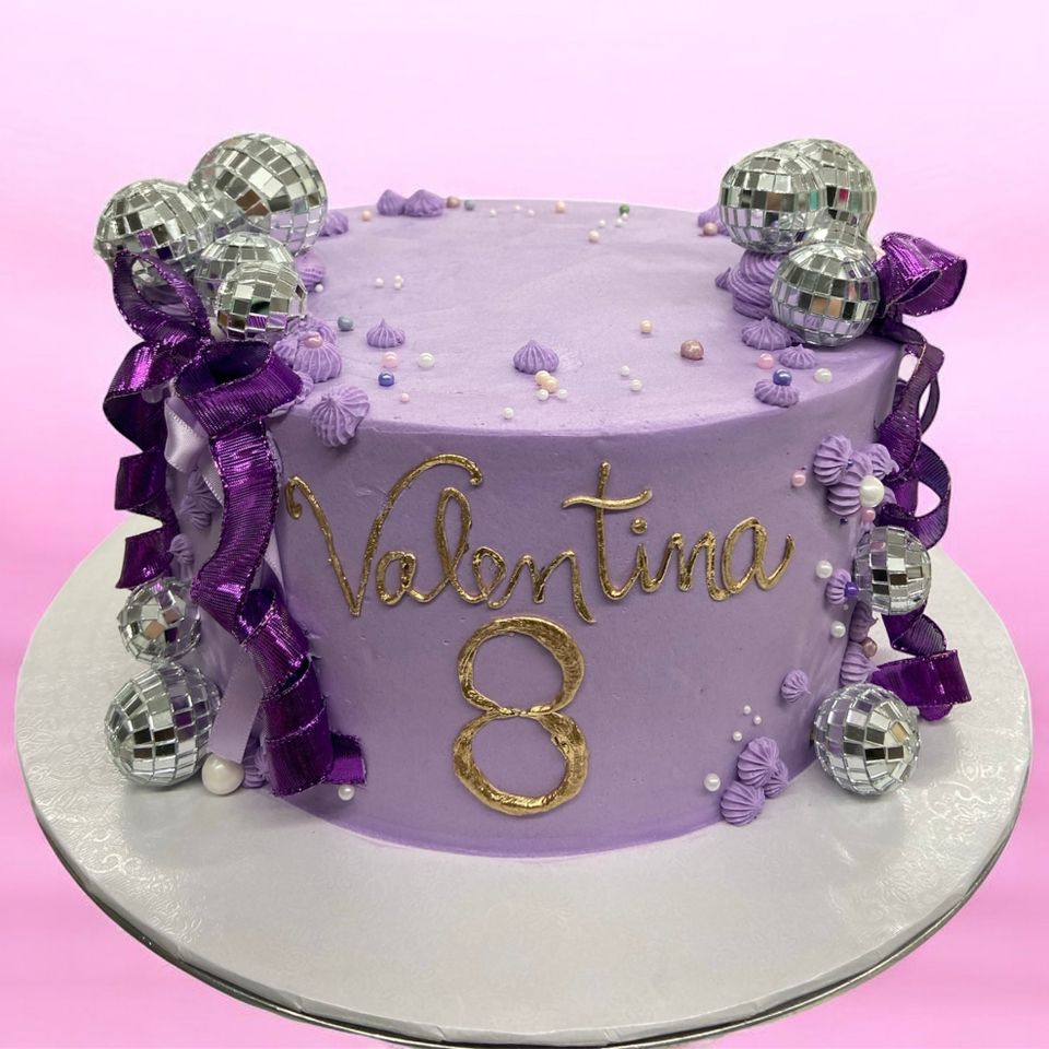 Purple birthday cake with blue diamon