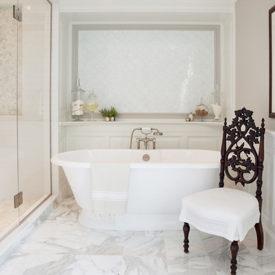 Beautiful white bathroom interior bathtub and shower with backsplash 