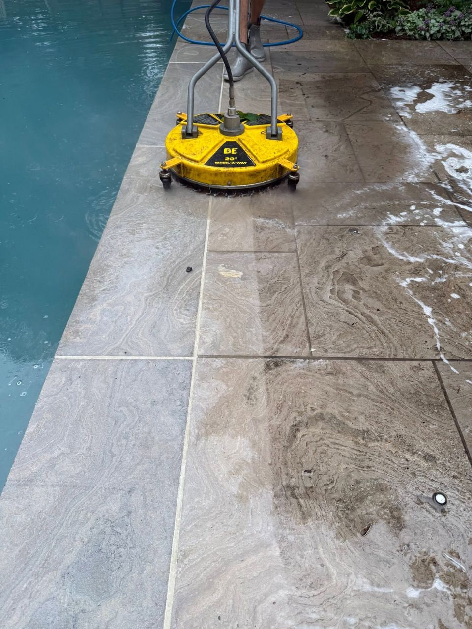 Surface cleaner pressure washing a stone pool deck at a Tillsonburg Ontario home