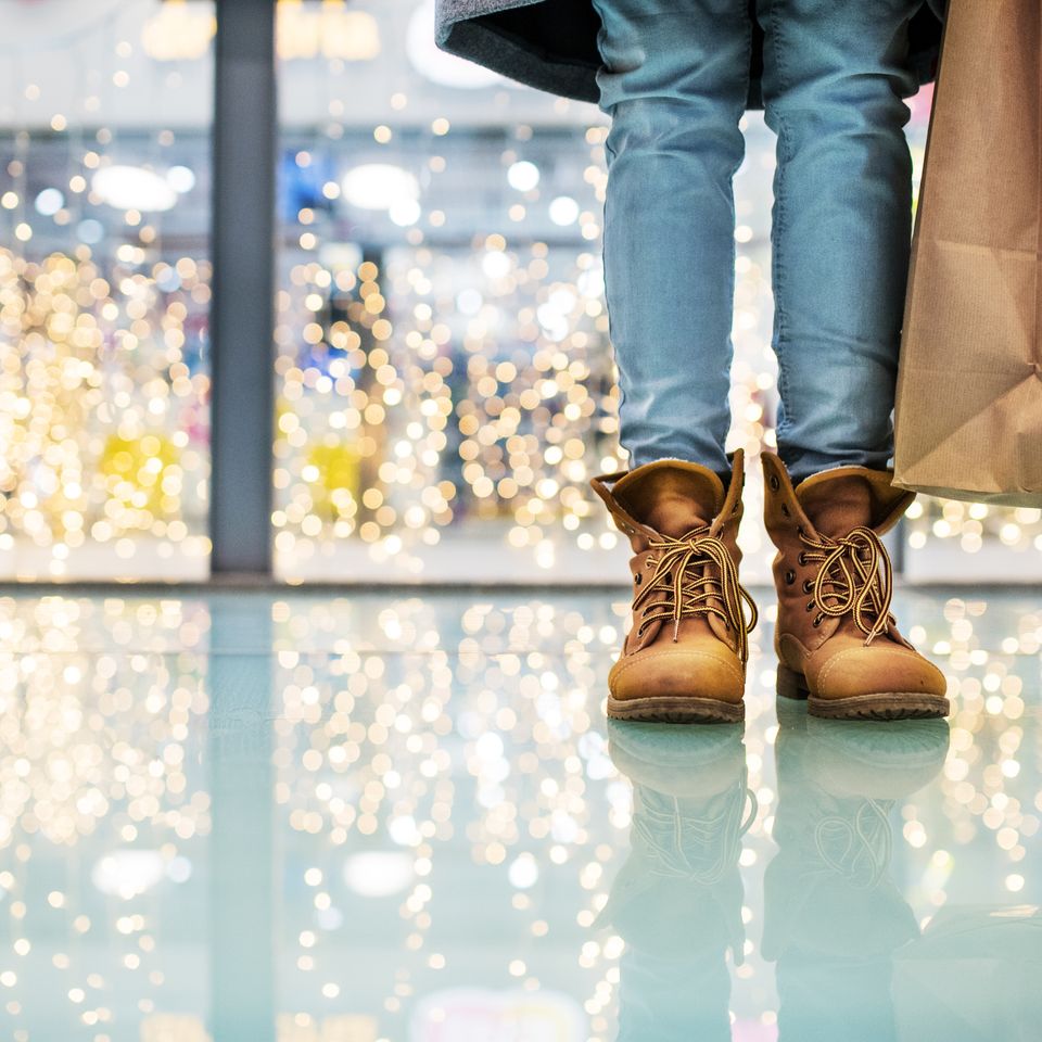 Legs of a woman with bags in shopping center at ch 2024 10 18 08 41 33 utc
