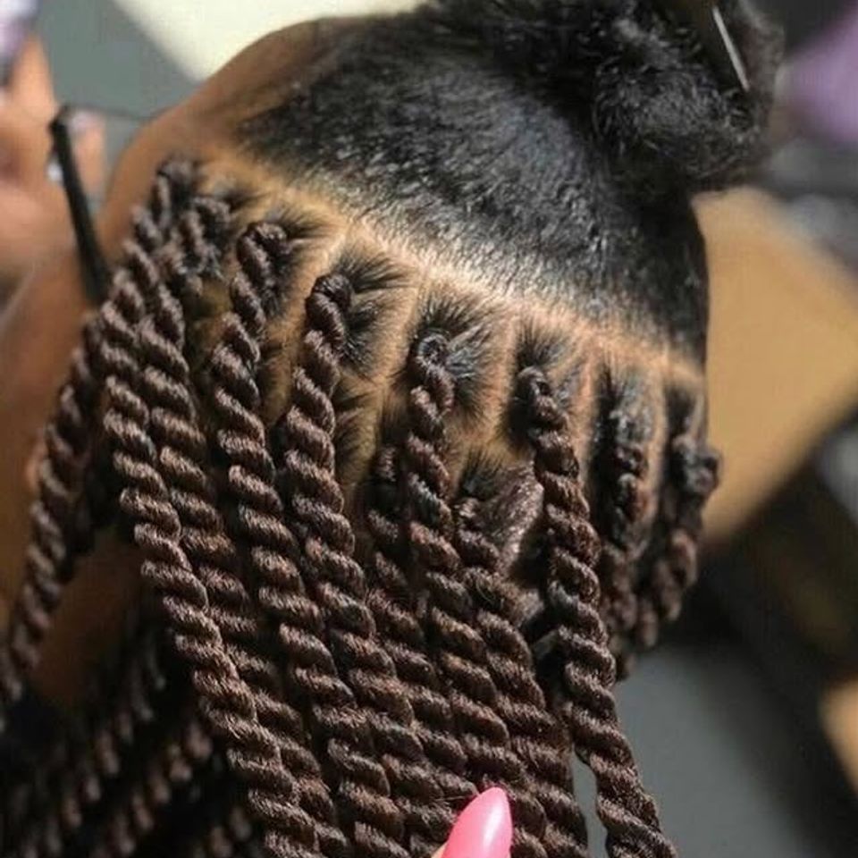Close up of neatly parted brown Senegalese twists after a braiding service in Los Angeles CA