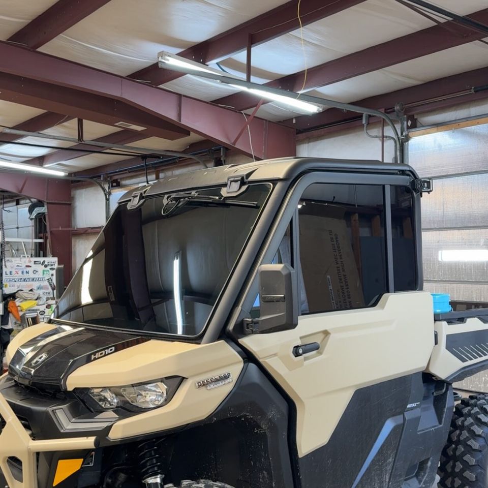 Can-Am Defender HD10 side by side with tinted cab glass in the Moyock NC tint shop