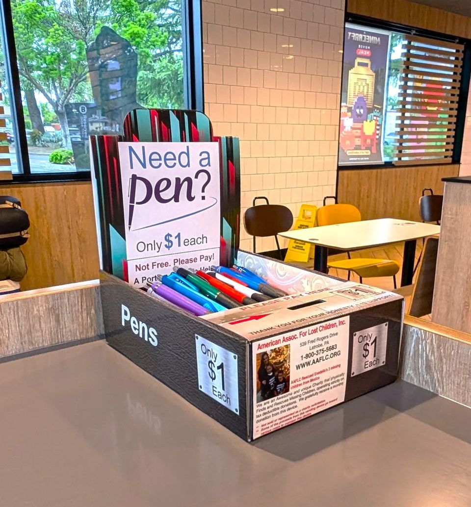 On location, fits nicely on the countertop. Filled with pens. Easy to operate side gig vending route.