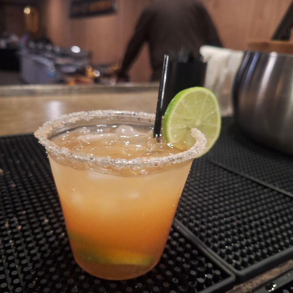 Freshly made Paloma with lime slice and salted rim