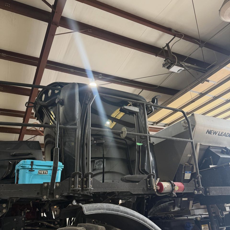 Agricultural sprayer cab with tinted glass in the shop for heavy equipment window tinting