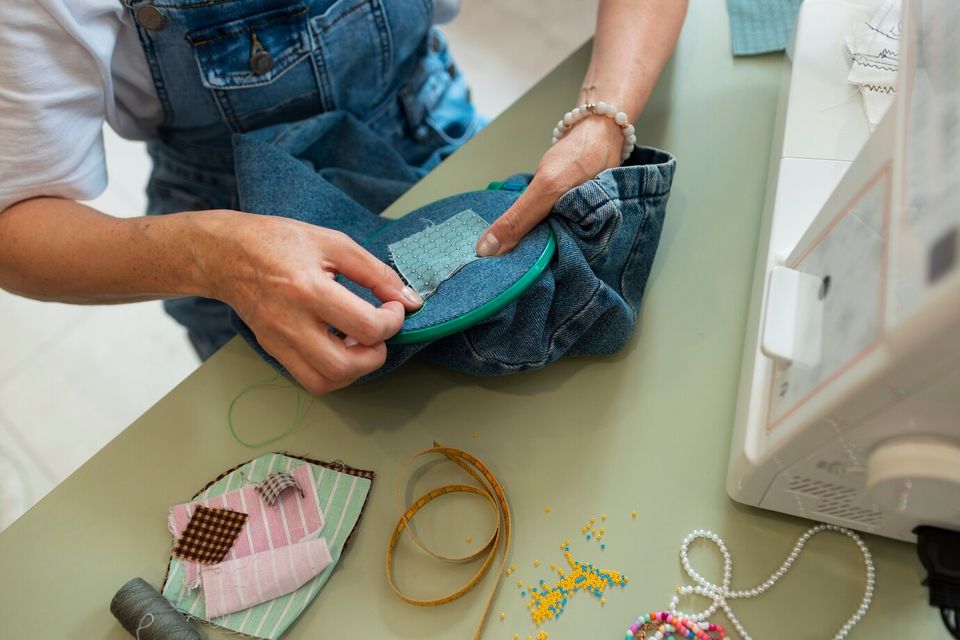 High angle woman repairing fashion goods 23 2150627952