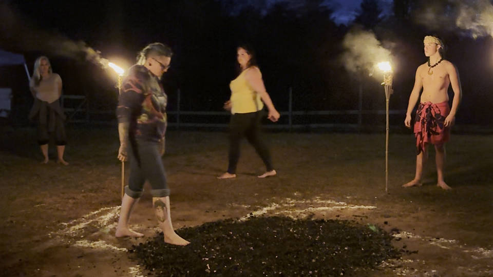 group firewalking experience celebrating breakthrough