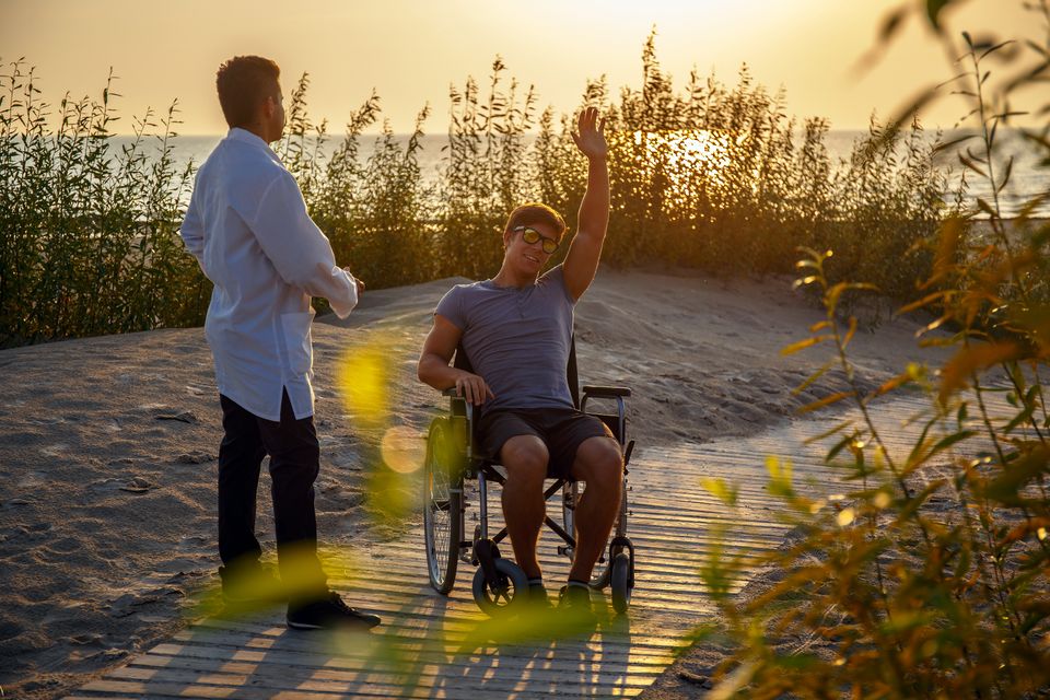 Young man wheelchair his doctor