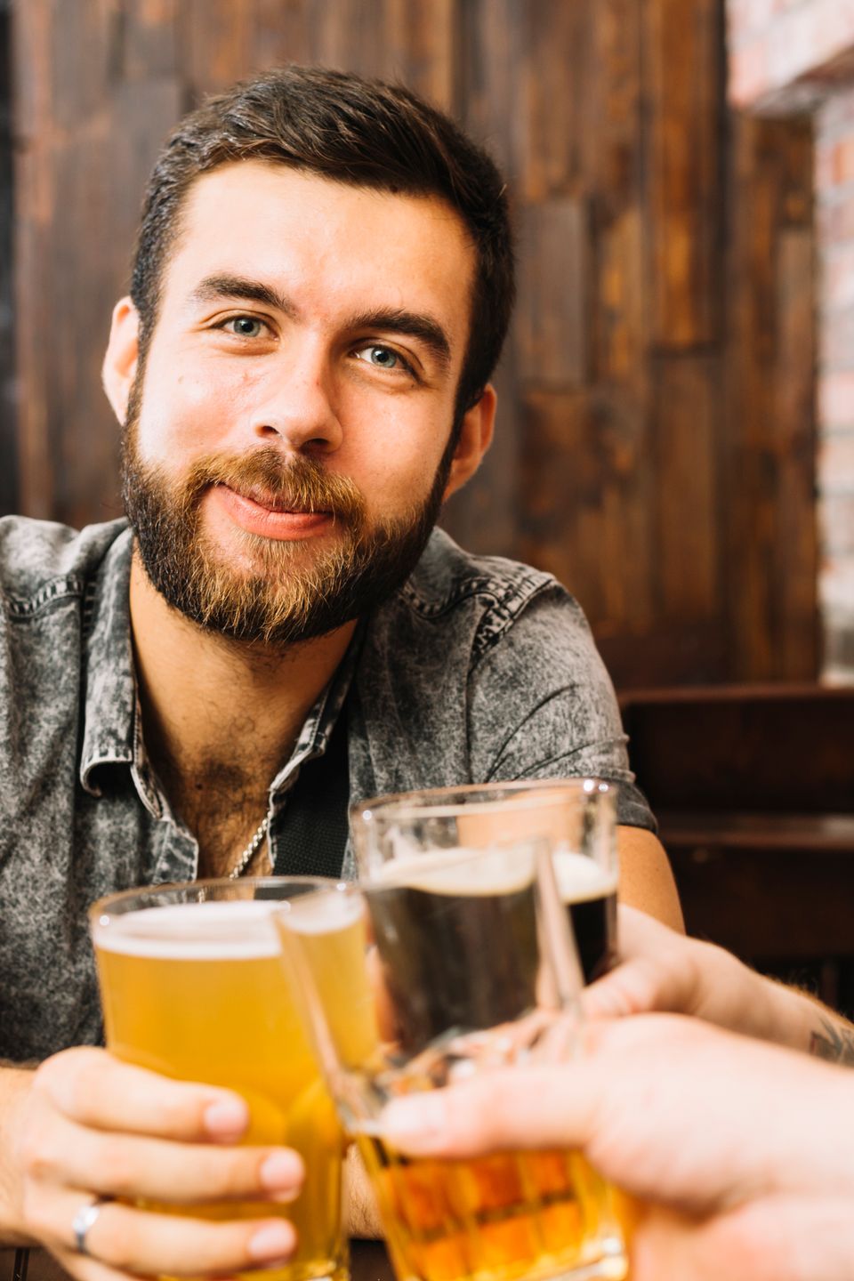 Man toasting alcoholic glasses