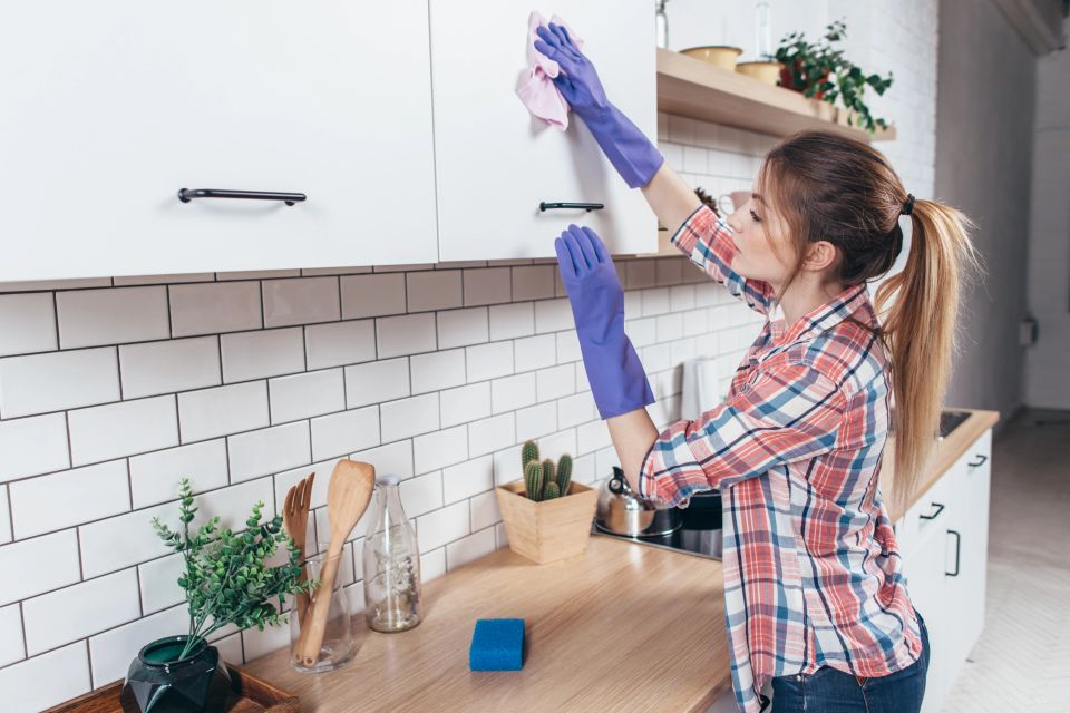 Professional cleaners tidying and organizing a modern, clean living space.