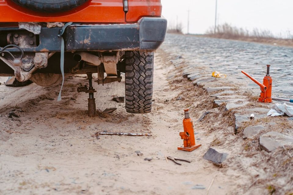 Man raises jack 4x4 off road truck 1153 4382