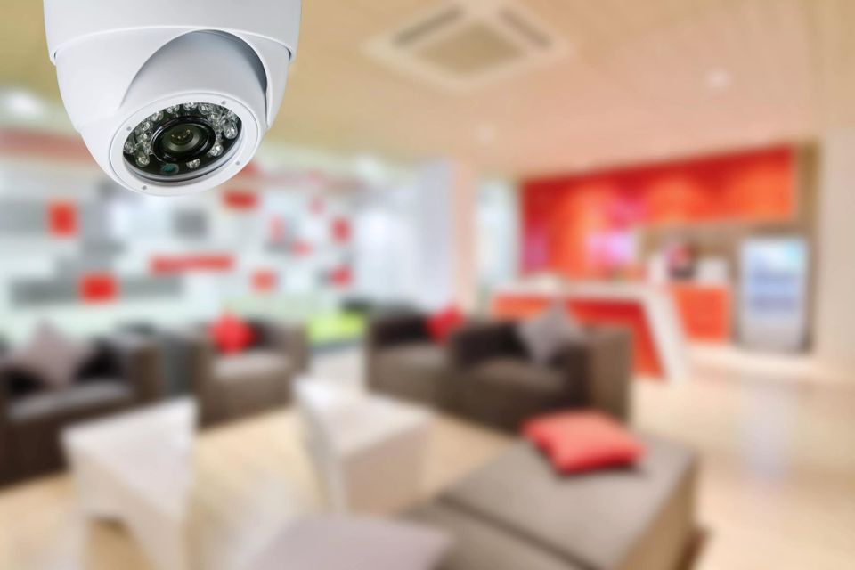 Network video recorder (NVR) and security cameras, part of a comprehensive security system.