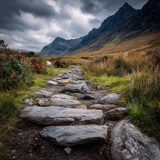A difficult stone trail on a cloudy day surrounded by mountain peaks 