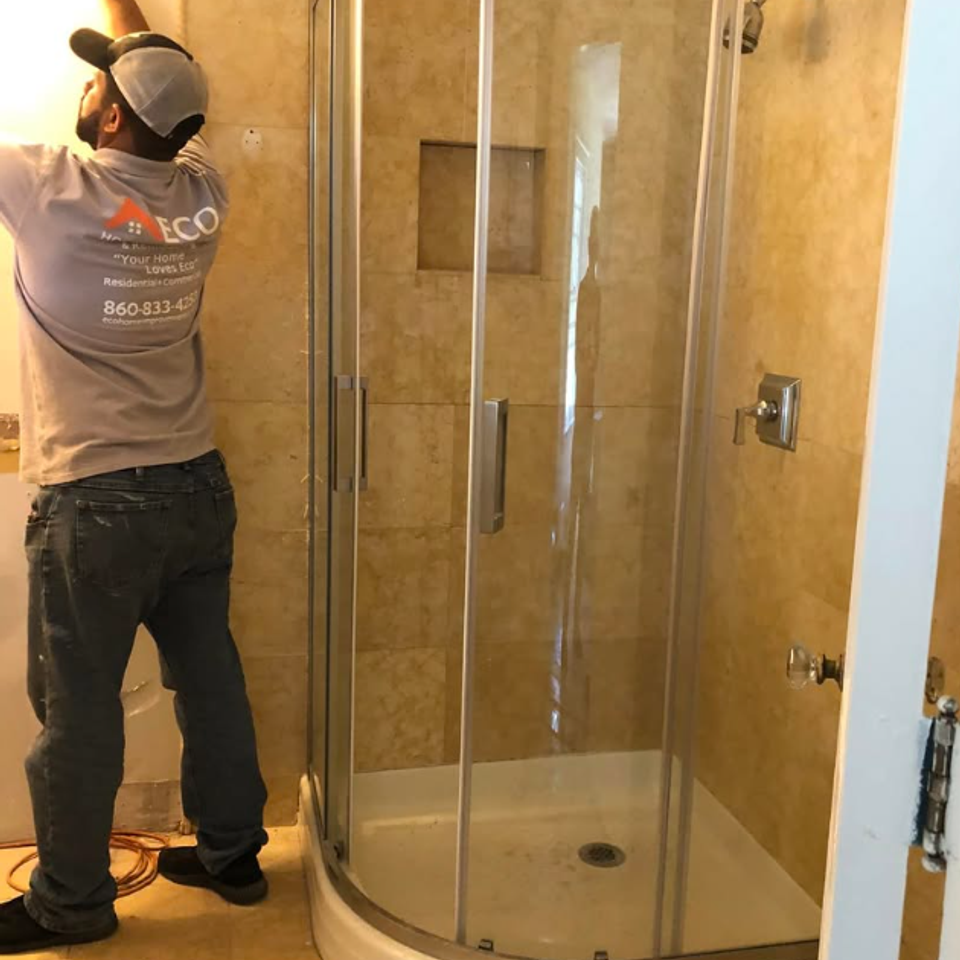 Curved glass corner shower installation