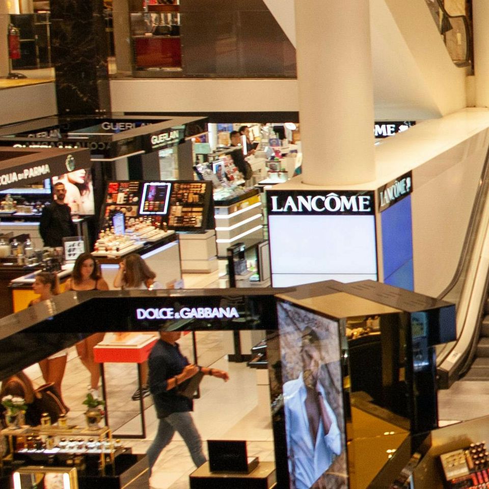 Wide-angle shot of a luxury perfume retailer in a mall