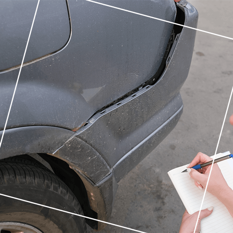Gray car with crushed bumper