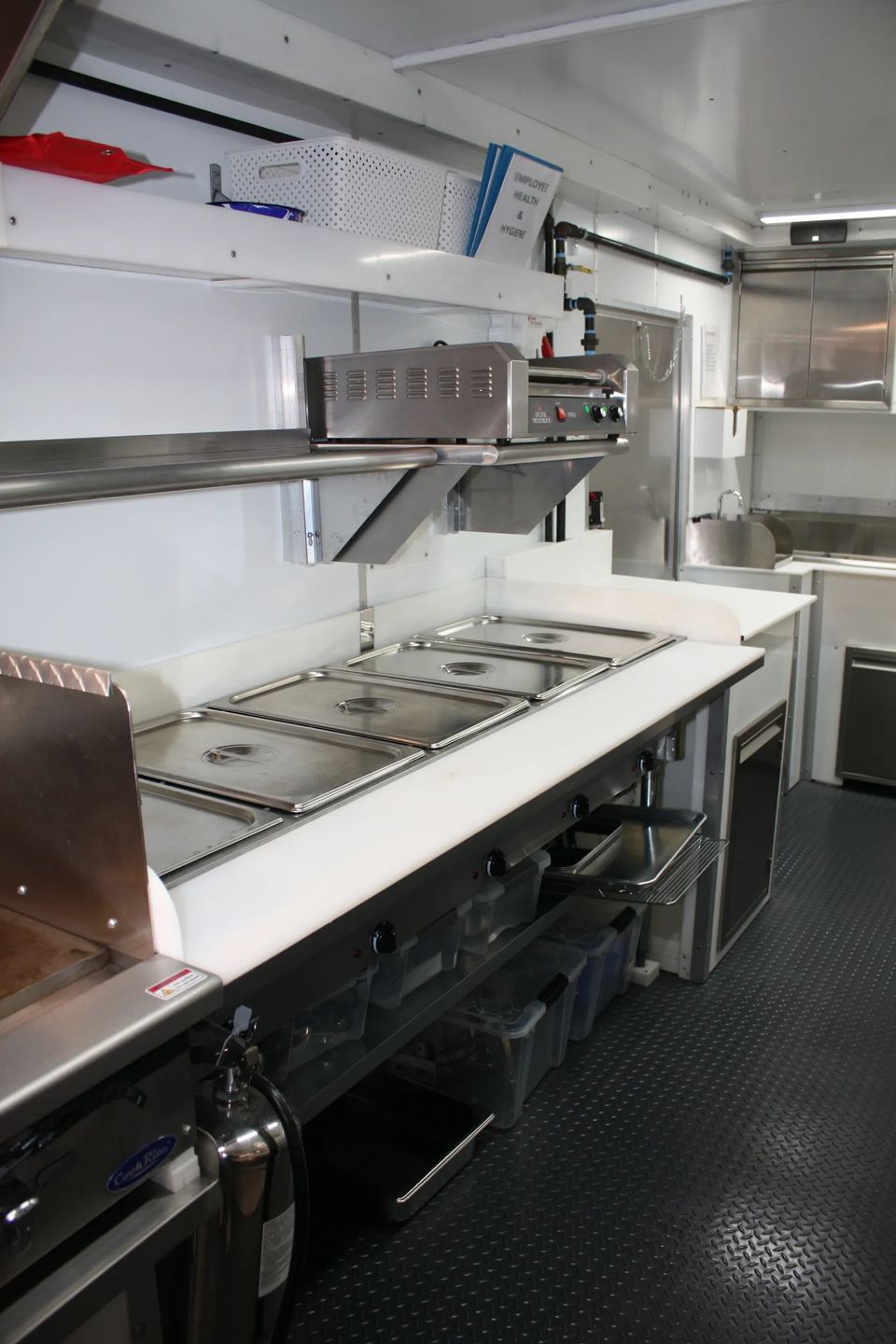 Steam table hot dog roller