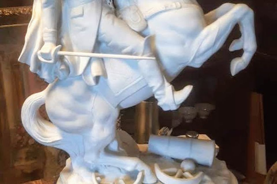 Porcelin man on horse