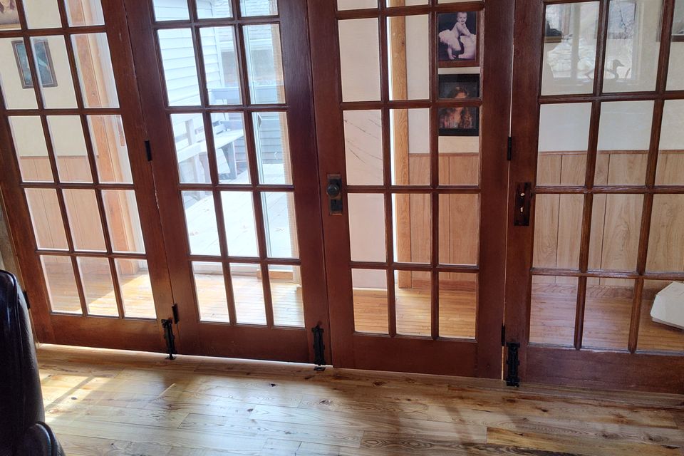 Frank's custom furniture finished installing tongue and groove flooringand french doors